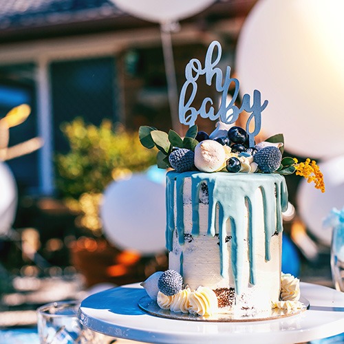 Baby shower cake on the decorated party table Baby Shower Cake
